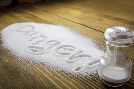 DANGER written on a heap of salt - Health Hazardの写真素材