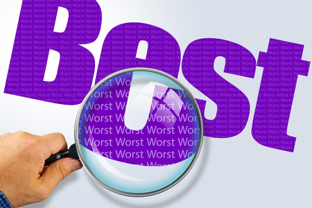 Human hand holding magnifying glass reading the word BEST hiding the opposite message WORSTViolet word on a white background. Antonym, hidden reality concept, Hidden messageの写真素材