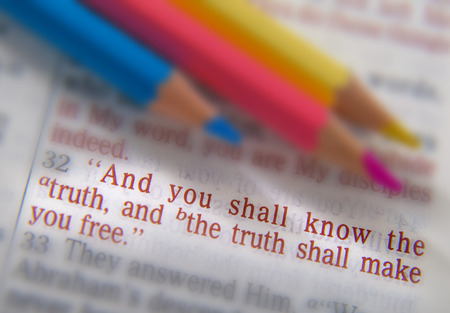 And you shall know the truth, and the truth shall make you free.Bible text from John 8:32, the Bible. Blue, red and yellow crayons. Visual effects to emphasize the message. Macroの写真素材