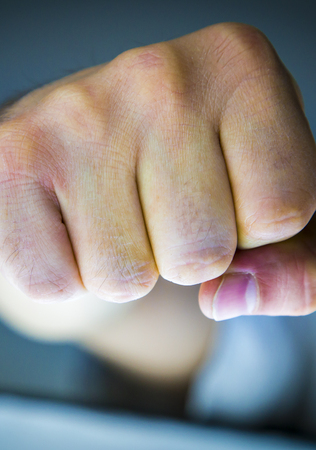 Human fists expressing power, violence, freedom, strenght, resistance