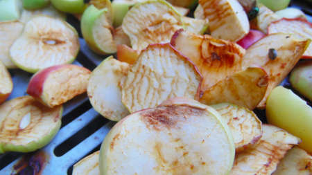 Sliced ââapples are dried in the sun. Fruit processing.の写真素材