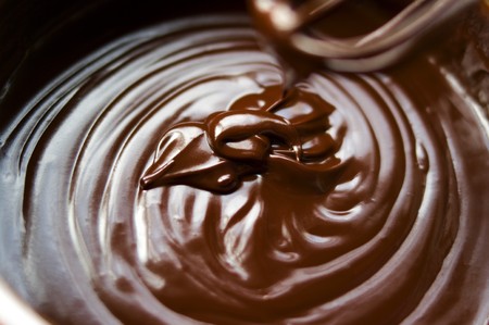 Making a chocolate sauce for a dessertの写真素材
