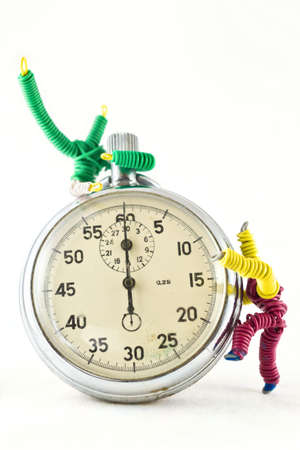 fun toys, mounted on a clock, isolated on whiteの写真素材