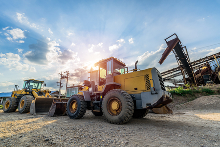 excavator at sandpit during earthmoving worksの写真素材