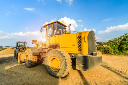 excavator at sandpit during earthmoving worksの写真素材