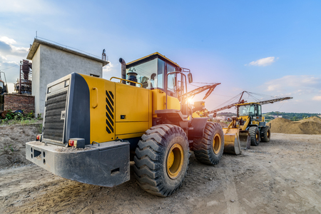 excavator at sandpit during earthmoving worksの写真素材