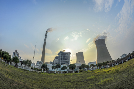 Nuclear power plant after sunset. Dusk landscape with big chimneys.の写真素材