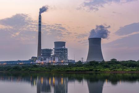 Nuclear power plant after sunset. Dusk landscape with big chimneys.の写真素材