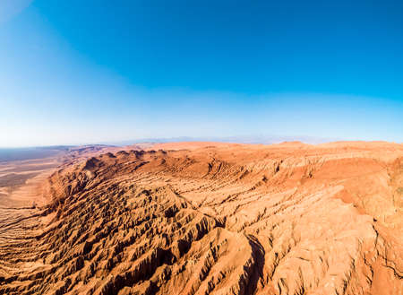 The Flaming Mountains are barren eroded red sandstone hills in Tian Shan Mountain range Xinjiang China.の写真素材