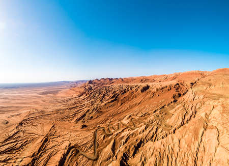 The Flaming Mountains are barren eroded red sandstone hills in Tian Shan Mountain range Xinjiang China.の写真素材