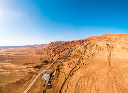 The Flaming Mountains are barren eroded red sandstone hills in Tian Shan Mountain range Xinjiang China.の写真素材