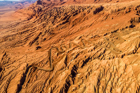 The Flaming Mountains are barren eroded red sandstone hills in Tian Shan Mountain range Xinjiang China.の写真素材