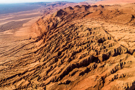 The Flaming Mountains are barren eroded red sandstone hills in Tian Shan Mountain range Xinjiang China.の写真素材