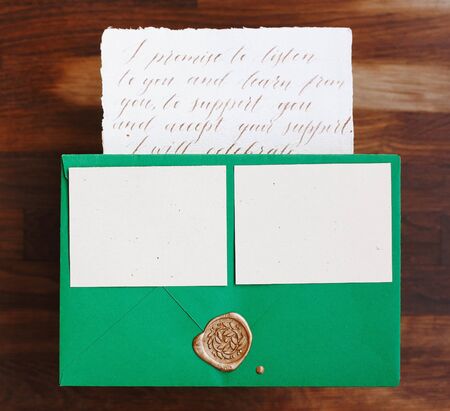Wedding details flat lay. Wedding invitation. Wooden background. Wedding bouquet. Copy space. Mock...