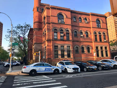 New York City Police Department 88th Precint, Brooklyn - Police station at the corner of Classon Avenue and Dekalb Avenue with several police interceptors parked in front of the building - New York Ciのeditorial素材