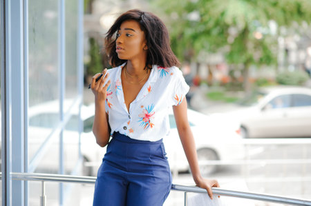 A shot of a beautiful black businesswoman outdoorの写真素材