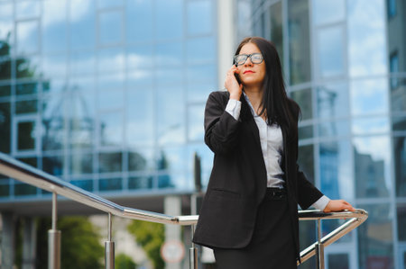 Girl with documents at a business meeting near a modern buildingの写真素材