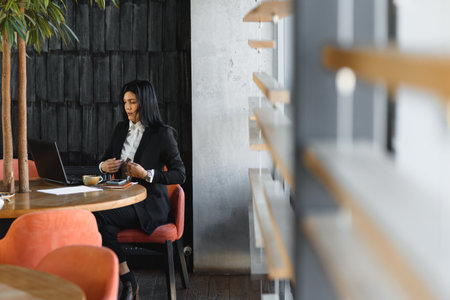 Young pretty business woman with notebook in the officeの写真素材