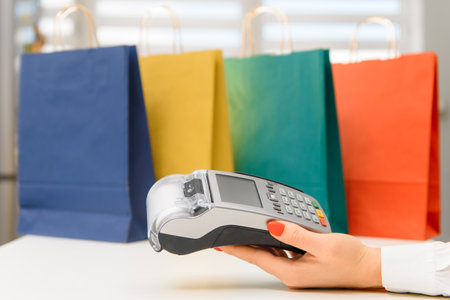 Closeup female hand holds terminal payの写真素材