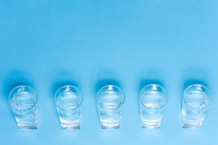 top of view of drink glasses with water, nutrition and health-care concept, nutrition and health-care concept on white backgroundの写真素材