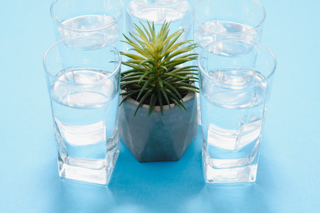 drinking water. Fresh water in glasses on blue backgroundの写真素材