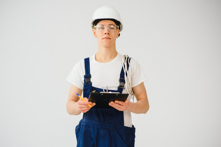 Builder in helmets on a white backgroundの写真素材