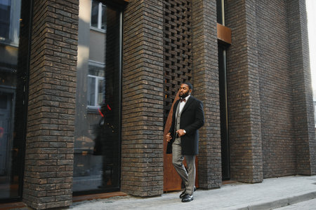 Portrait of an handsome businessman walking in a business environmentの写真素材