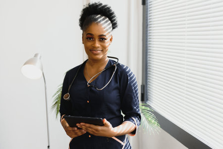 medicine, people and healthcare concept - african american female doctor or nurse at hospital