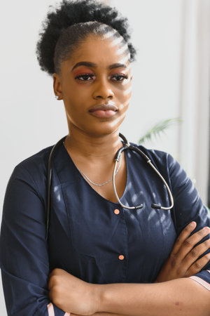 An African American female medical doctor with a stethoscope in hospitalの写真素材