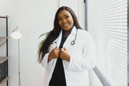 An African American female medical doctor with a stethoscope in hospital
