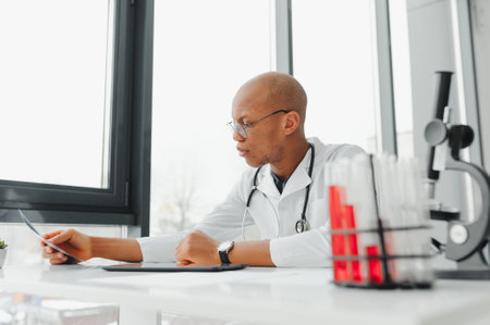 African doctor looking at a radiography