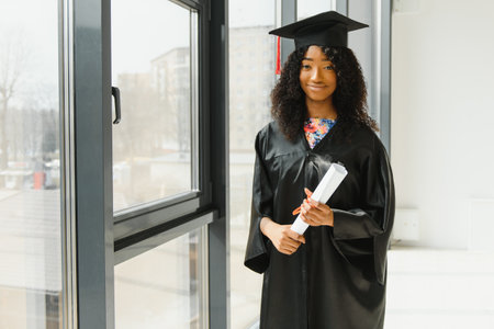 Excited African American woman at her graduation.