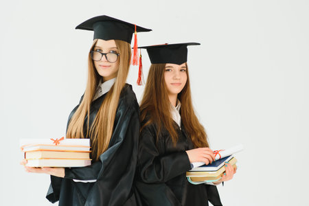 Pretty female college graduate at graduation with classmatesの写真素材