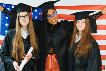 portrait of multiracial graduates holding diploma