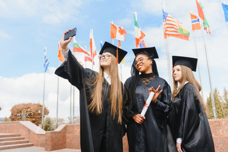 group of multiracial university graduates at graduation ceremony