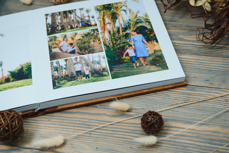 premium photo book, large size, natural wood cover, quality binding. Family photobook, recreation memoriesの写真素材
