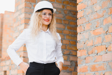 A portrait of engineer woman looking construction. Concept Engineer and business work.