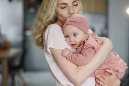 Portrait of mother and child laughing and playing