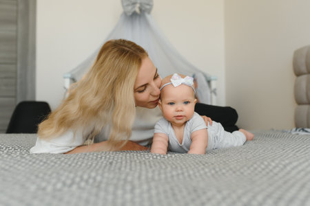 Portrait of mother and child laughing and playing