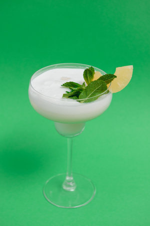 Pina Colada in front of green backgroundの写真素材