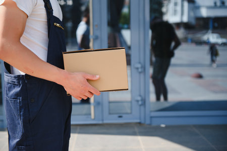 Postman with parcel box. postal delivery service.