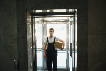 happy delivery man with boxの写真素材