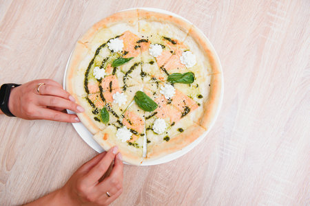 smoked salmon pizza isolated on white background - Italian food styleの写真素材