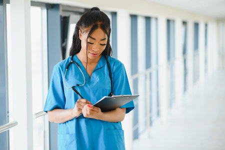 beautiful african american female pediatric nurse in modern officeの写真素材