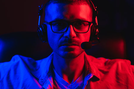 Professional Gamer Plays Video Game on His Computer. He's Participating in Online Cyber Games...