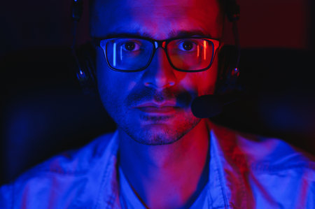 Professional Gamer Plays Video Game on His Computer. He's Participating in Online Cyber Games...