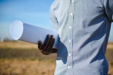 Engineer African man standing with wind turbine