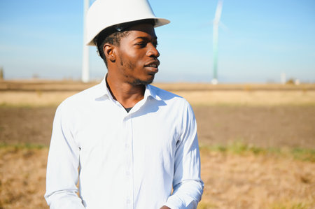 African American worker in a construction helmet
