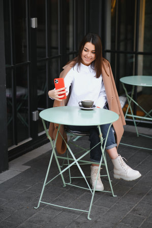 girl use your break at work to drink coffee and chatの写真素材