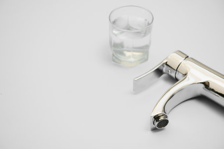 Single handle water tap isolated on whiteの写真素材